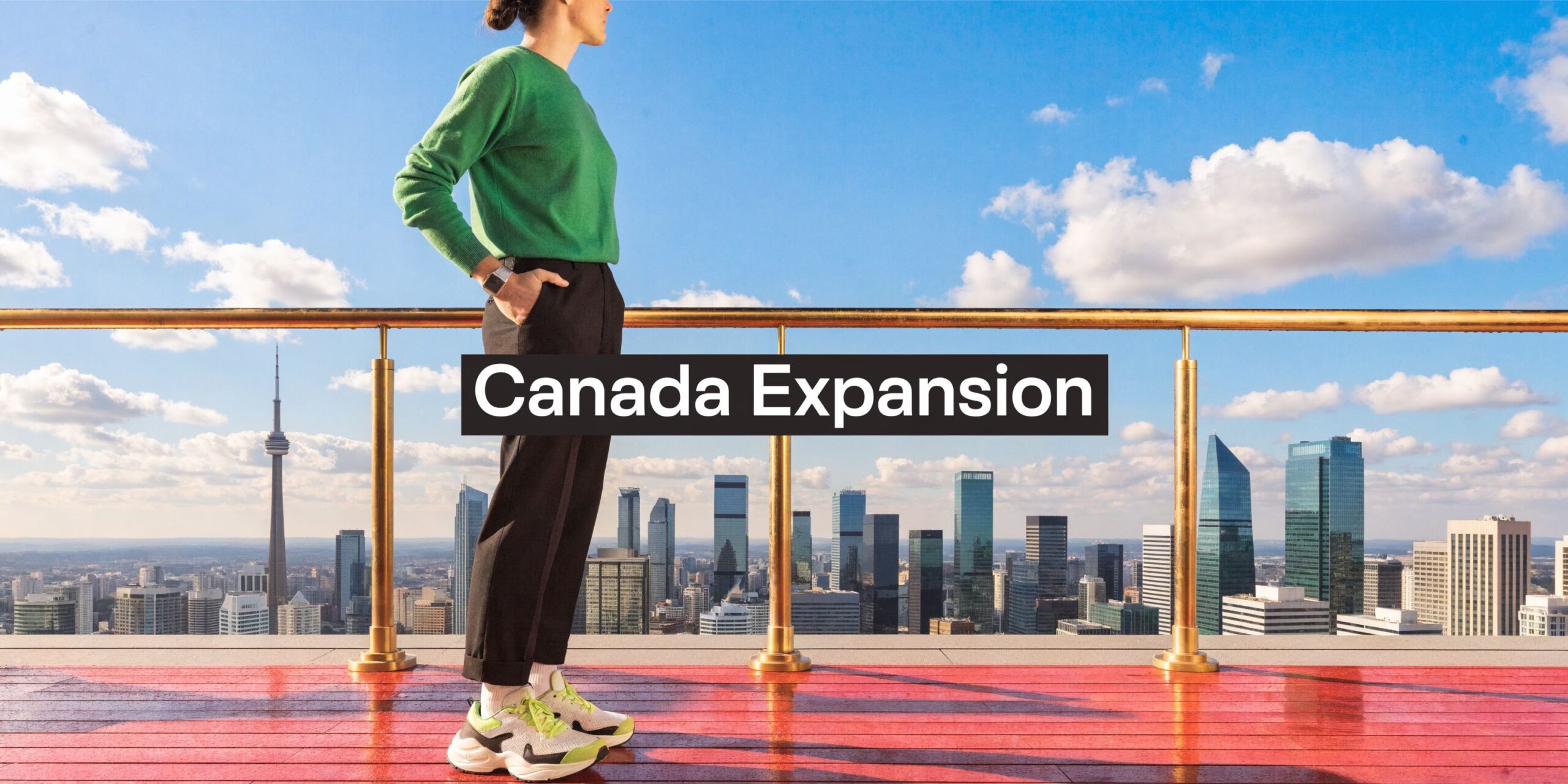 A person standing on a balcony overlooking the Toronto skyline with the text Canada Expansion.