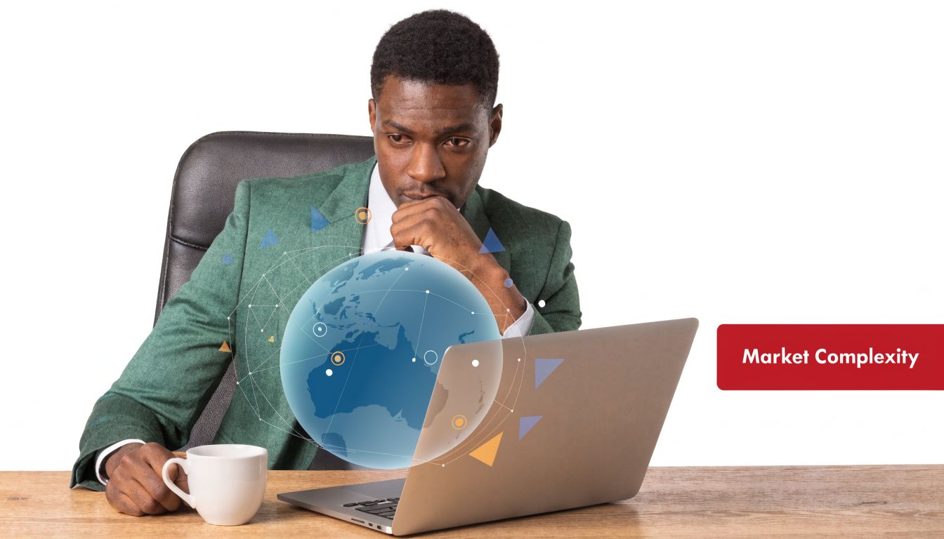A professional man sitting at a desk looking thoughtfully at a digital globe visualization on his laptop.