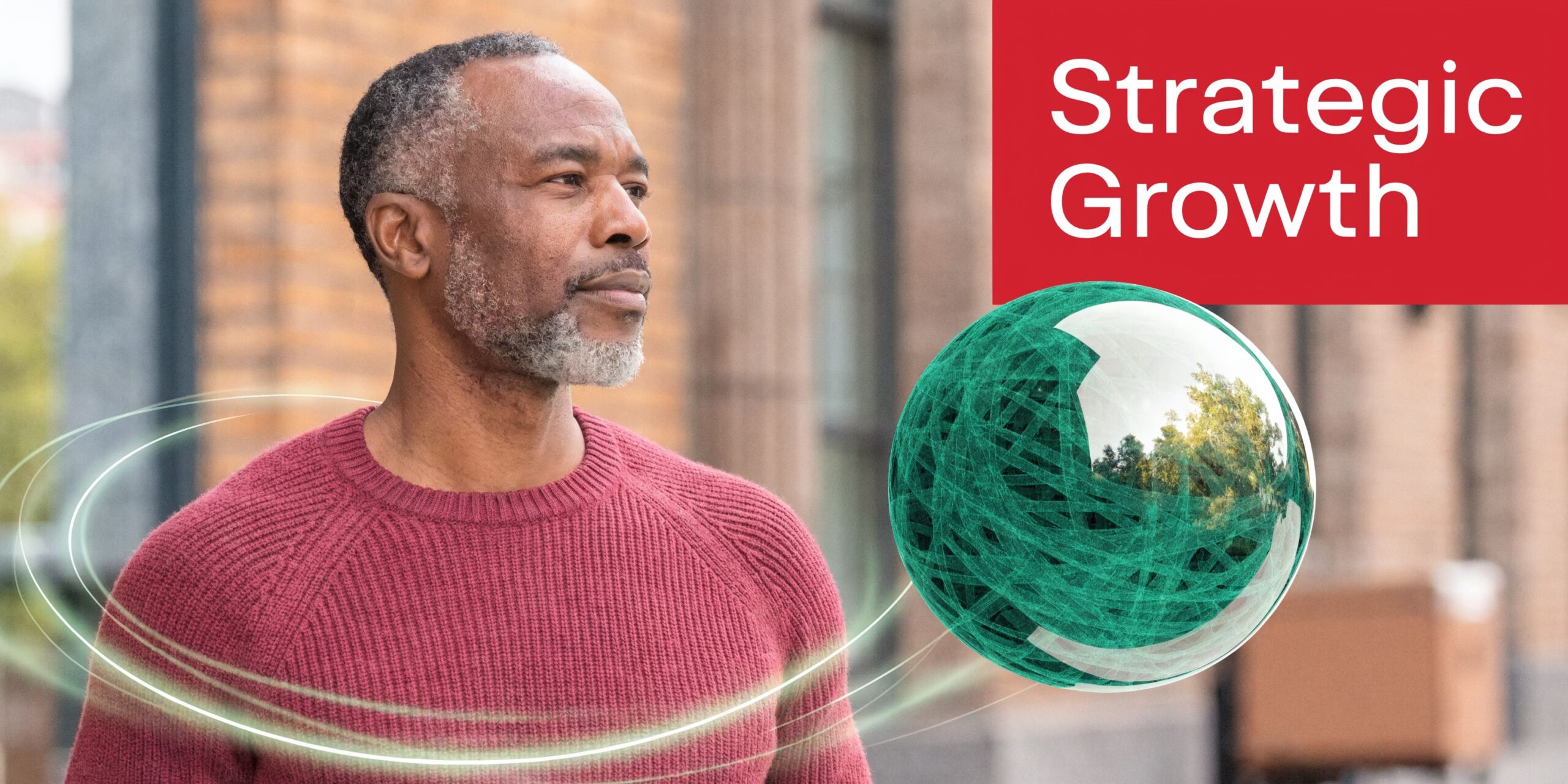 A professional man with grey hair looking towards a futuristic green orb symbolizing strategic business growth.