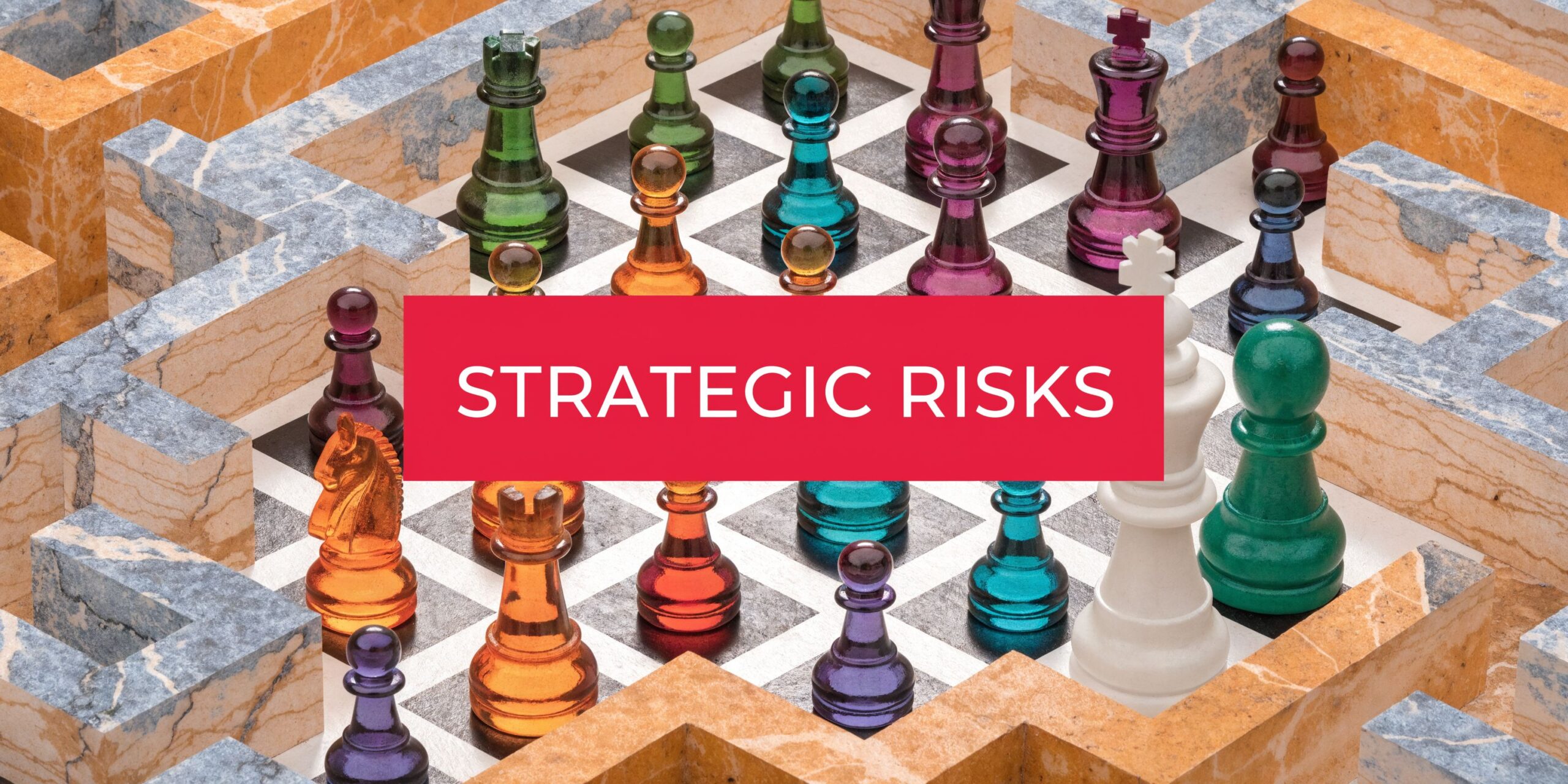 A close-up of a colorful glass chess set inside a marble labyrinth with Strategic Risks text overlay.