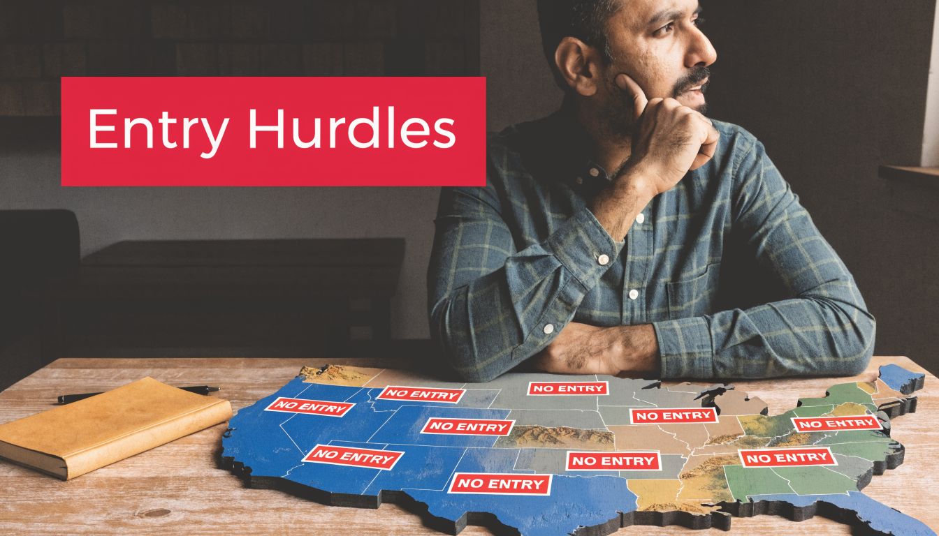 A man looking thoughtfully at a wooden map of the USA covered with red No Entry signs.